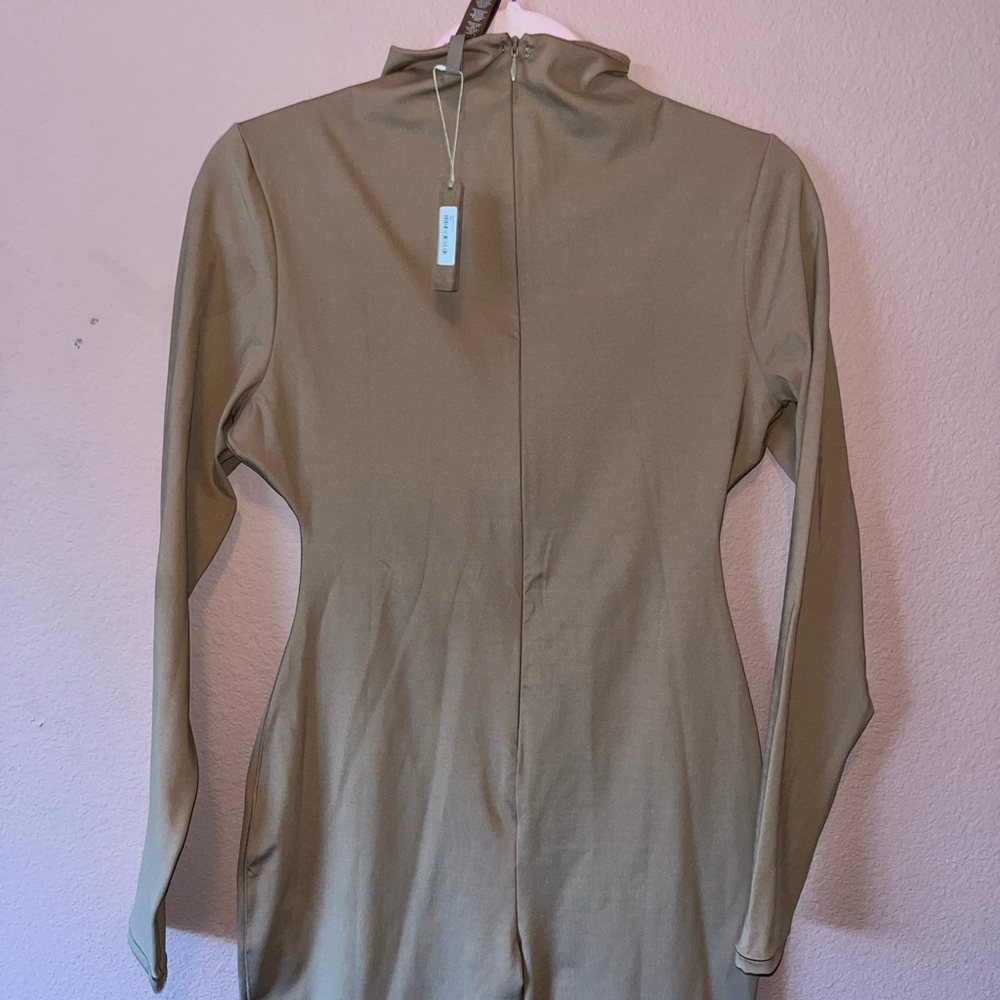 Skims suit with zipper on the back it’s nude
